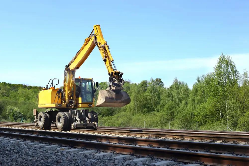Excavators machine excavate on railway.